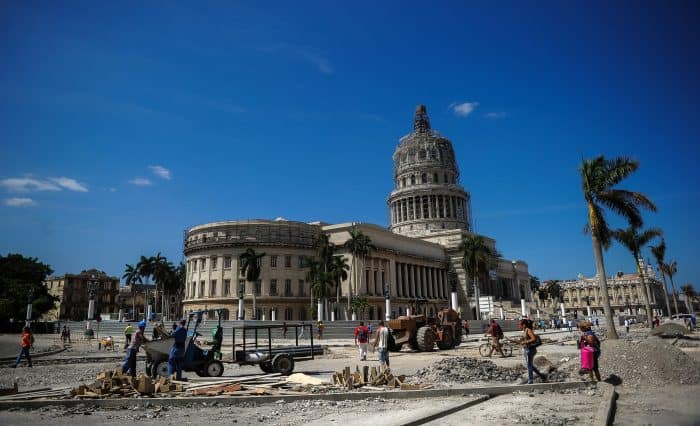 Workers repair a street near the Capitol in Havana, Cuba, on March 16, 2016, during preparations ahead of U.S. President Barack Obama's visit. 