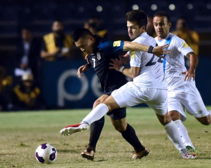 The U.S.' Bobby Wood, left, is marked by Guatamala's Rodrigo Saravia during their Russia 2018 FIFA World Cup Concacaf Qualifiers' football match, in Guatemala City, on March 25, 2016.