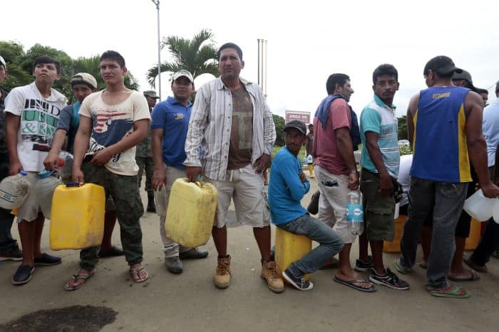 people lined up to get water after Ecuador earthquake