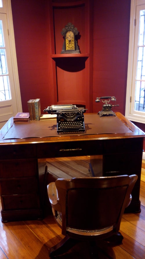 Desk with Olivetti typewriter and early telephone.