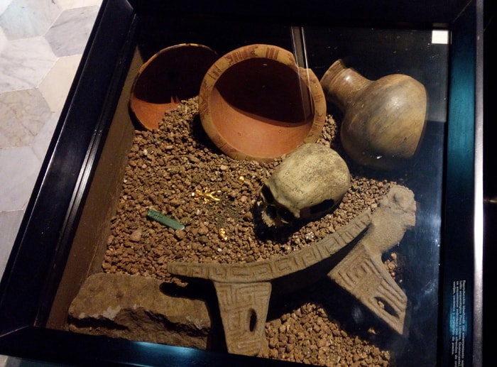 Recreation of indigenous grave, with gold and jade amulets.