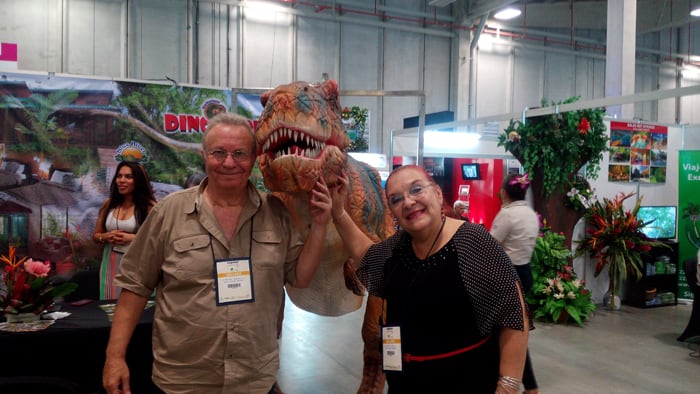 Daniel Apelboim and Violeta Hansen of Blue River Lodge and Dino Park, with dino friend.
