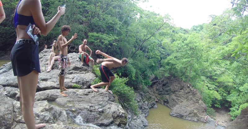A visitor prepares to leap from the upper fall at Montezuma.