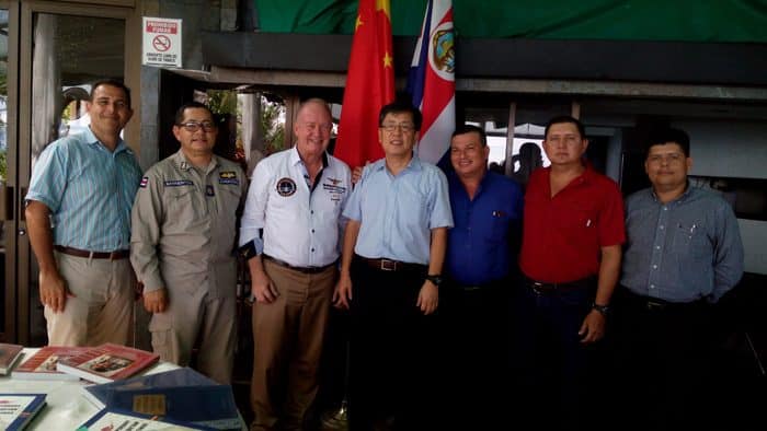 Chinese Ambassador Song Yanbin, center, with officials of the municipality of Quepos, the Coast Guard Academy, Palma Tica palm oil company and the Chamber of Commerce.