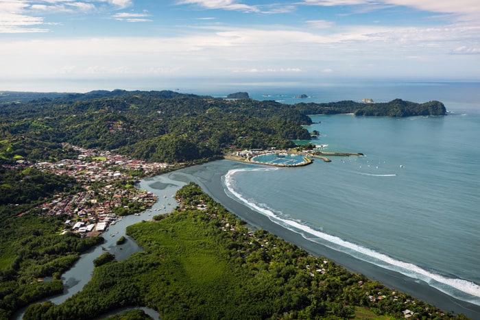 Quepos from the air: Mangroves, town, marina, Punta Quepos and in the distance Manuel Antonio.