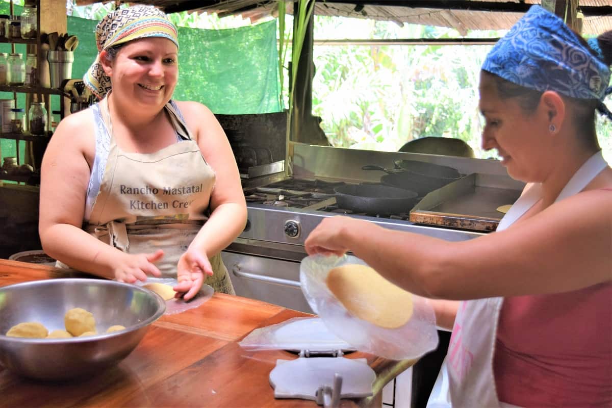 Two women making tortillas in Costa Rica.