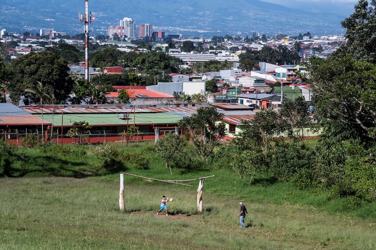 A boy and his grandfather play soccer in San José, Costa Rica.