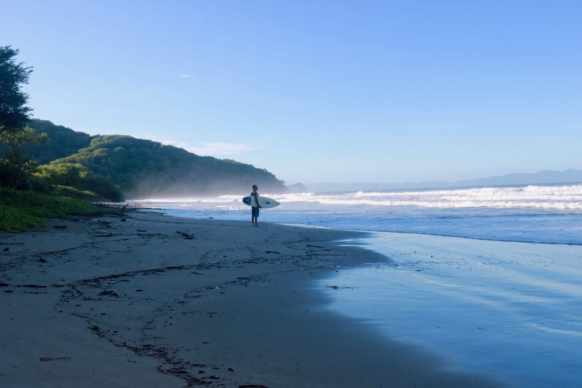 Surfer at Playa El Coco, Nicaragua.