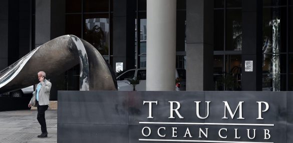 A man walks next to the Trump Ocean Club International Hotel in Panama City.