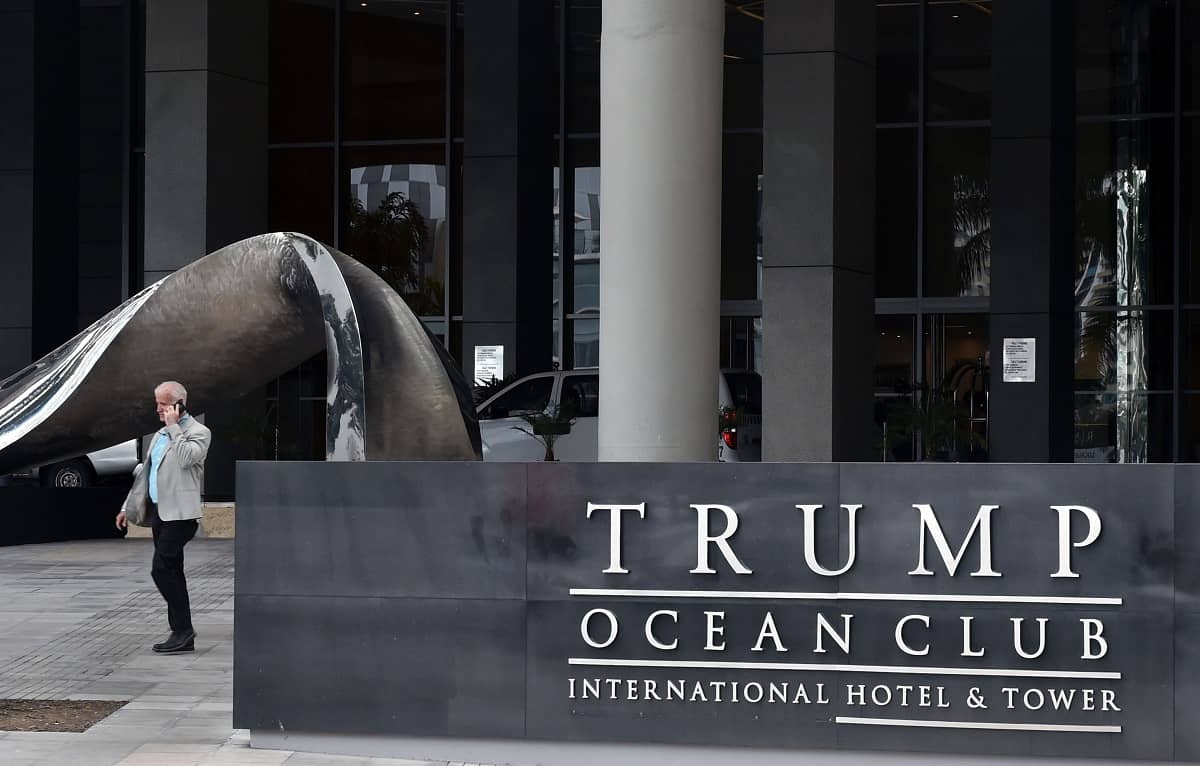 A man walks next to the Trump Ocean Club International Hotel in Panama City.