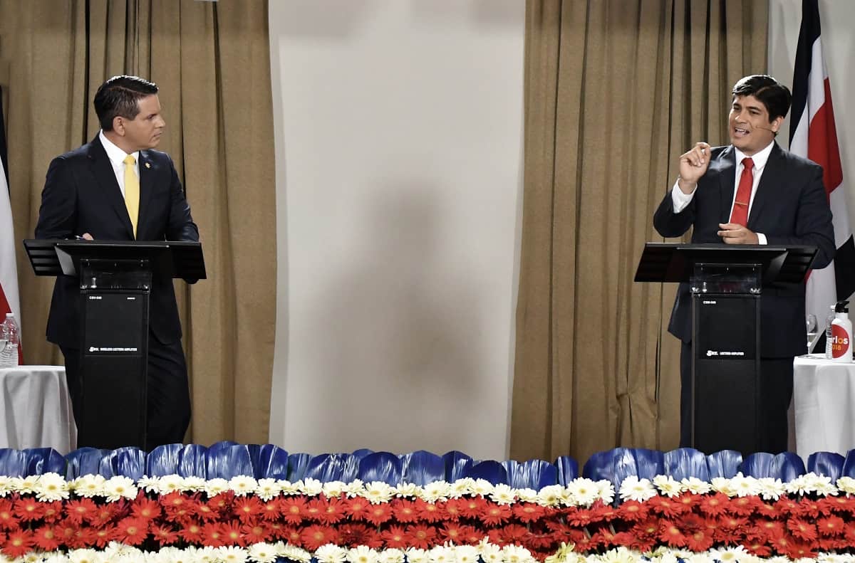 Costa Rican presidential candidate Fabricio Alvarado (L) of National Restoration (RN) and Carlos Alvarado (R) of Costa Rica's governing Citizen Action Party (PAC), participate in the Grupo Extra debate ahead of the country's 2018 presidential runoff in San José, Costa Rica, March 19, 2018.