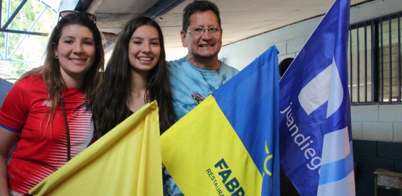 A family of voters with different party flags in La Carpio, San José, Costa Rica, on Feb. 4, 2018.