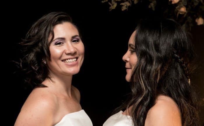 Newlyweds Alexandra Quiros (L) and Daritza Araya in Costa Rica