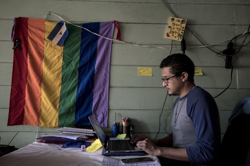 Nicaraguan Carlos Berrios works during an interview with AFP, at his house in San Jose on July 31, 2020. - Berrios, afraid for being a human rights activist of the LGBTI community, fled Nicaragua and moved to Costa Rica.