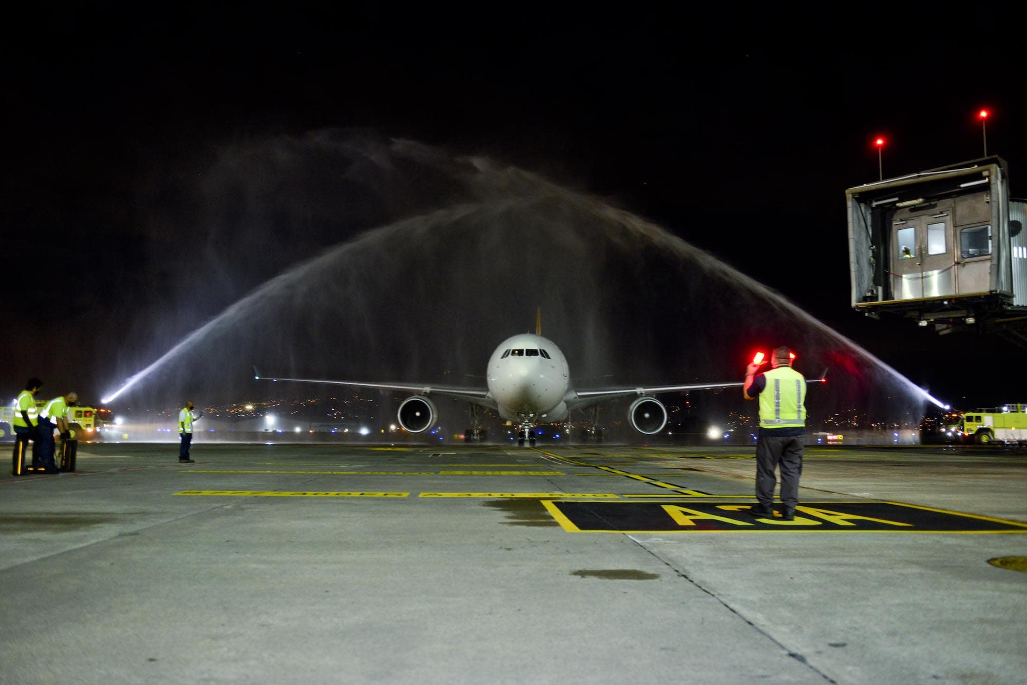 An Iberia A330-200 is welcomed with a water-cannon salute as Costa Rica welcomes the return of international tourists.