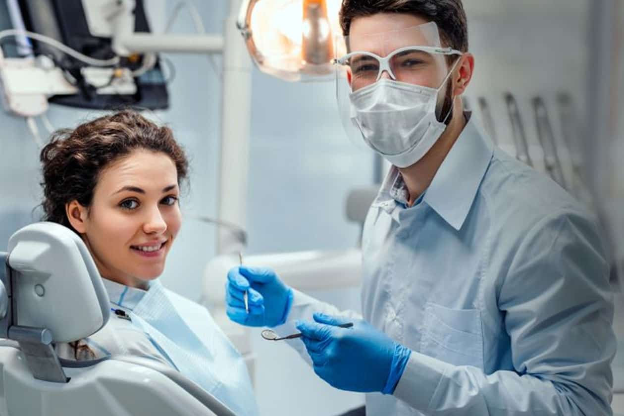 Take proper precautions, but don't delay what could be an important dental checkup.
