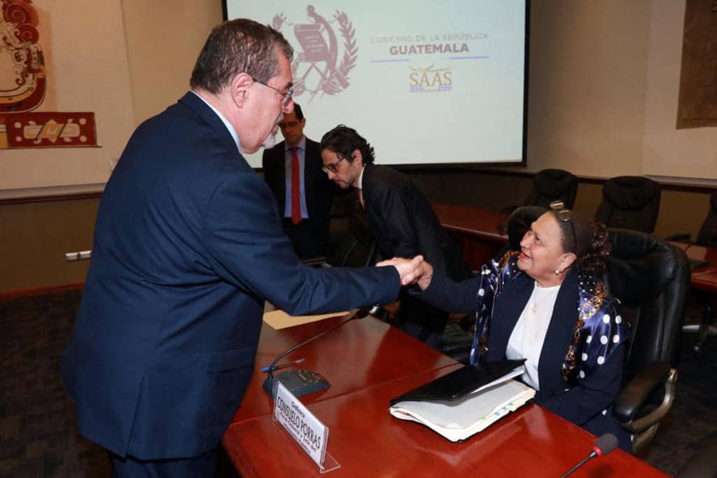 Guatemala's President Bernando Arevalo (L) greets Attorney General Consuelo Porras
