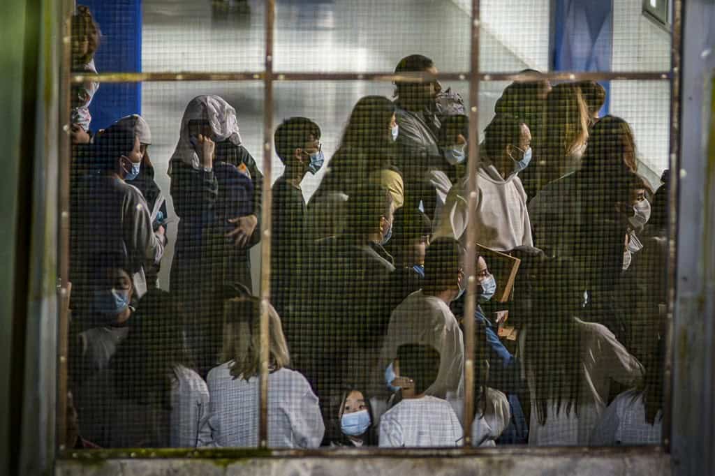 Migrants deported from the United States enter Catem shelter