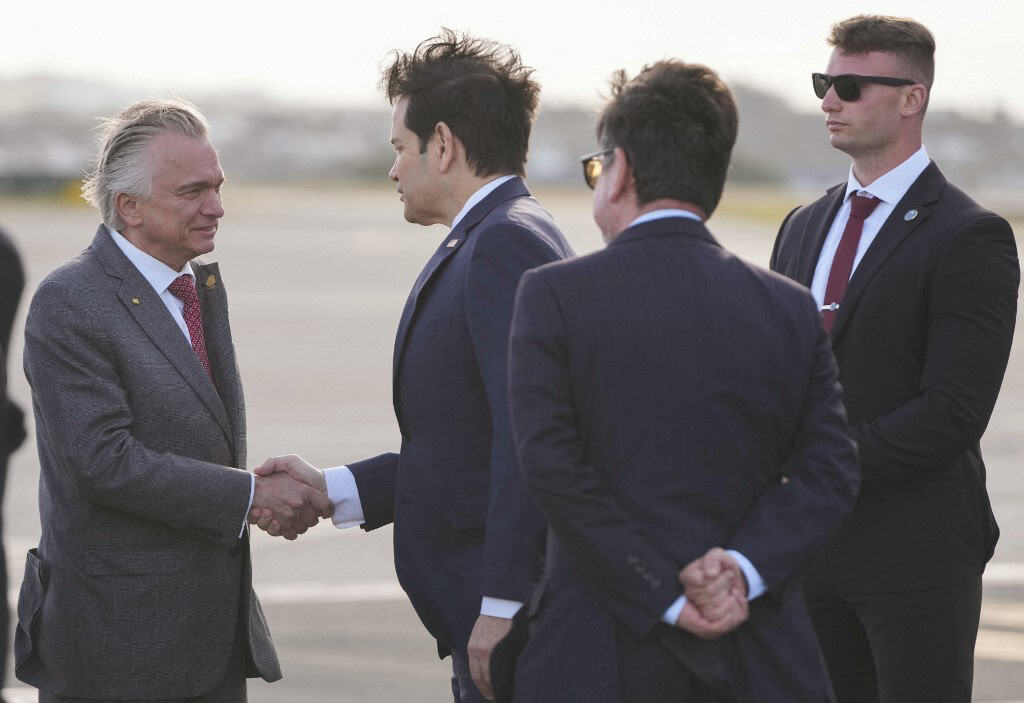 US Secretary of State Marco Rubio (C) shakes hands with Costa Rica Foreign Minister Arnoldo Andre Tinoco