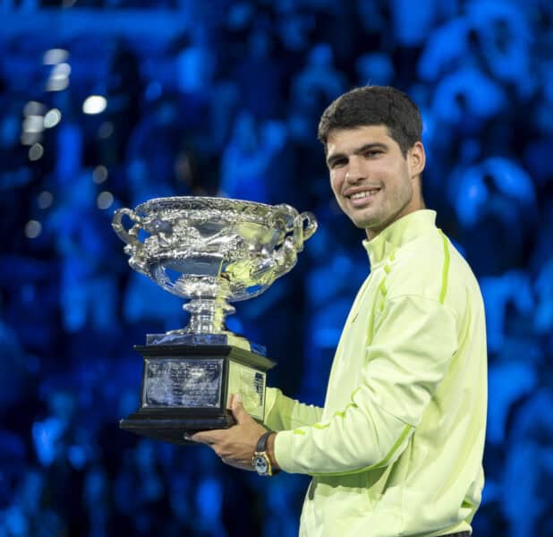 Carlos Alcaraz holds trophy after he wins Australian Open 2026