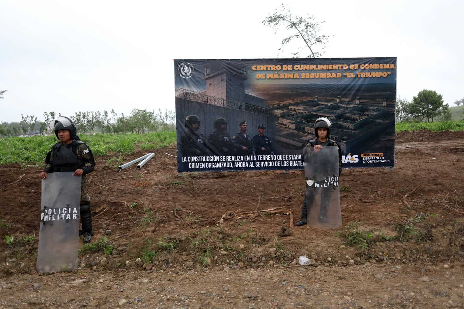 Guatemala Military Police officers stand guard during a groundbreaking
