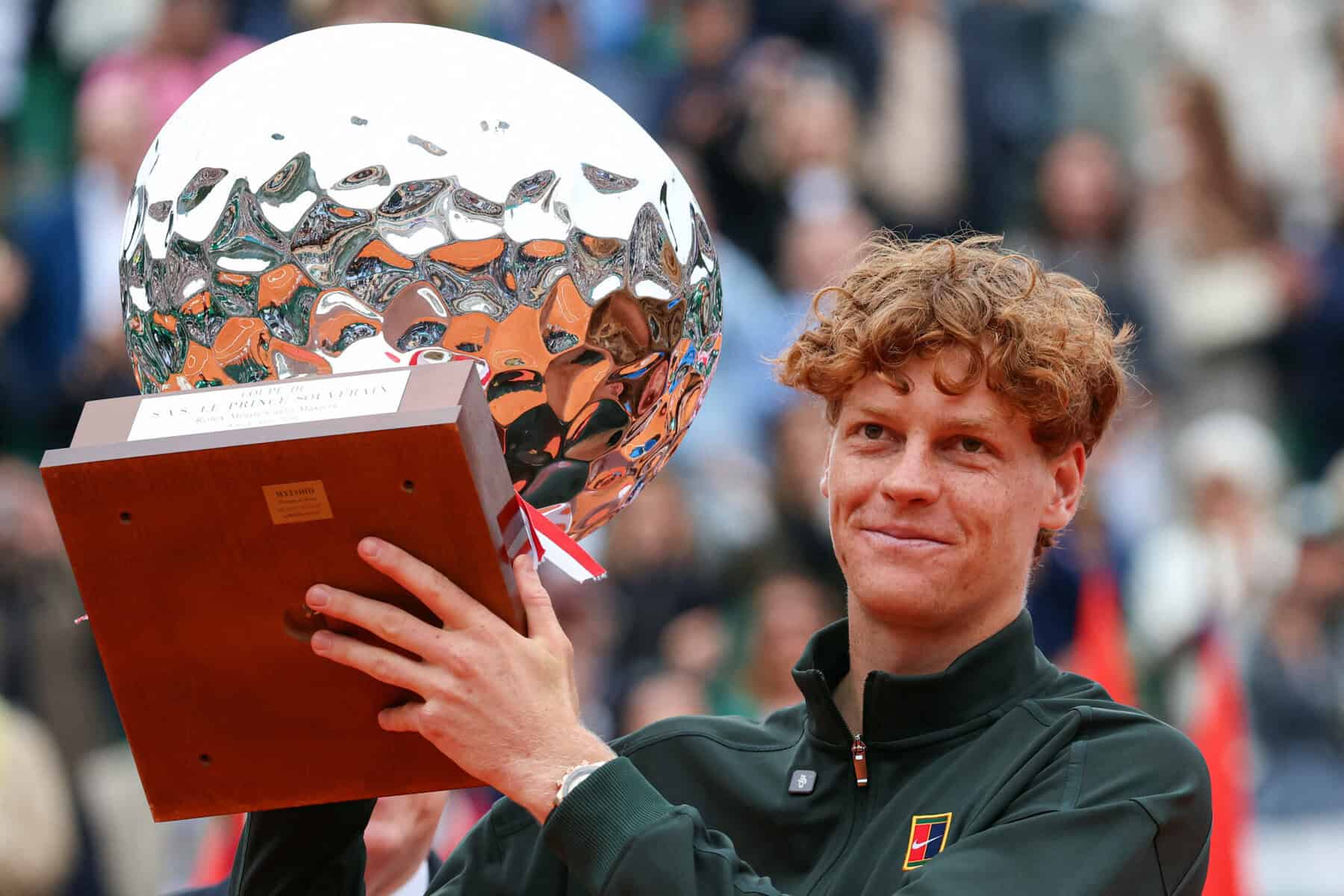 Jannik Sinner holding trophy after beating Carlos Alcaraz to win the Monte Carlo Masters