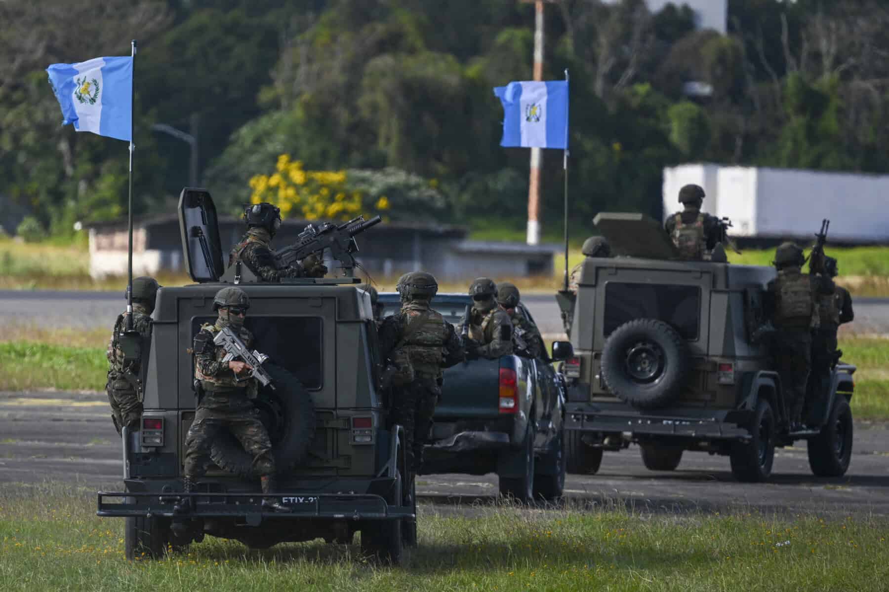 Guatemalan army soldiers and Jeep