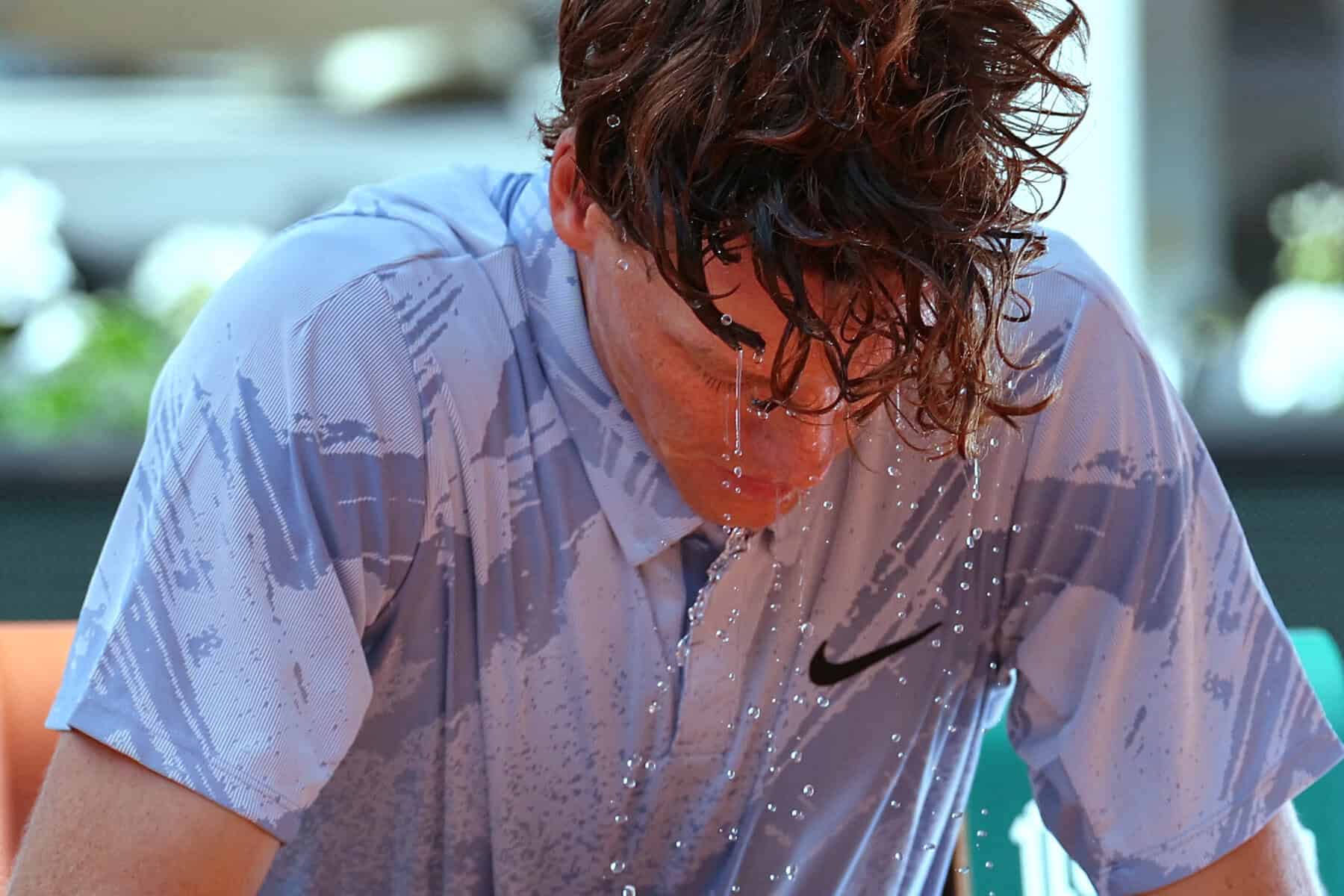Italy's Jannik Sinner tries to cool down at the French Open