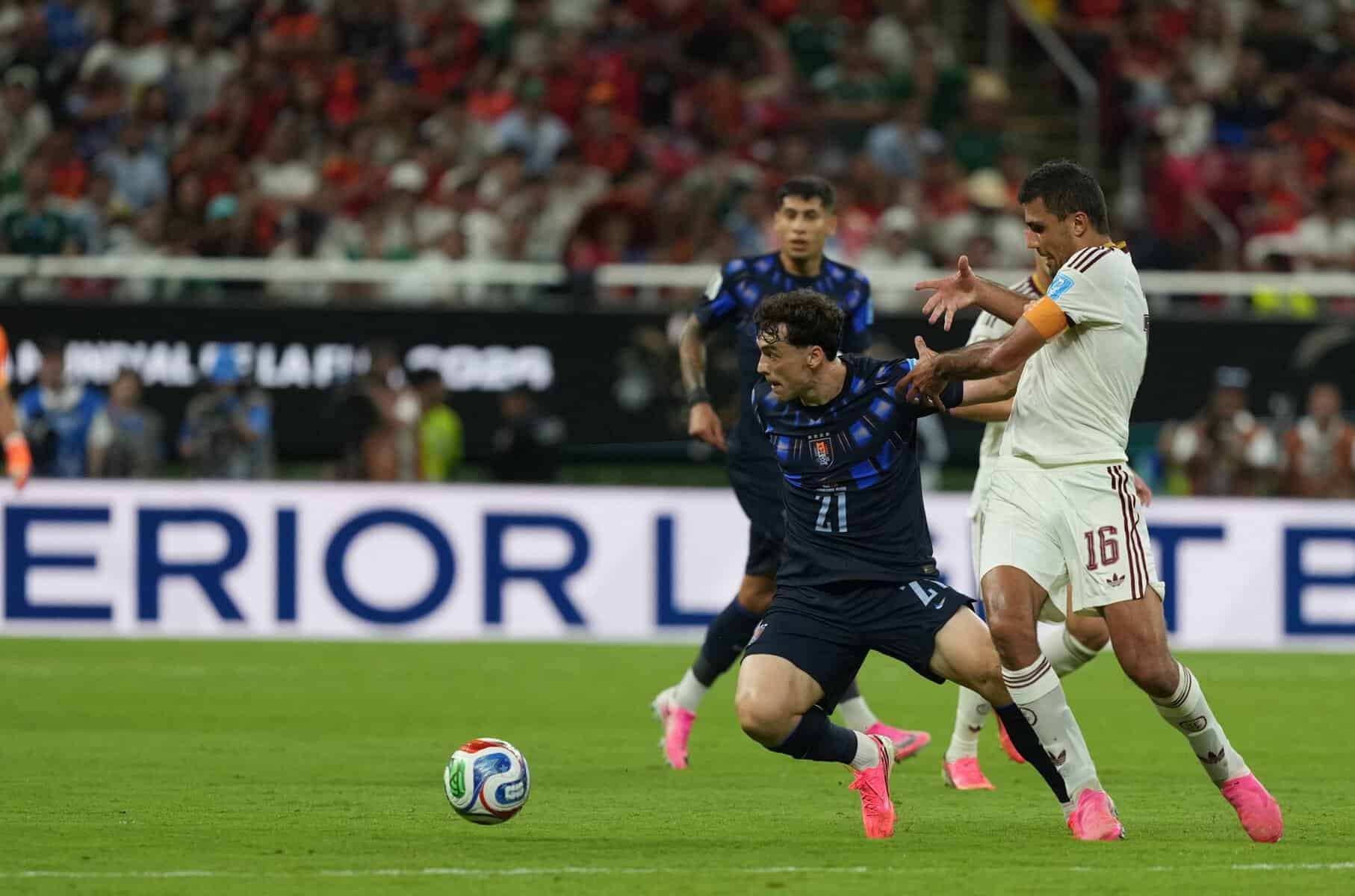 Rodri (16) of Spain in action against Vinas (21) of Uruguay