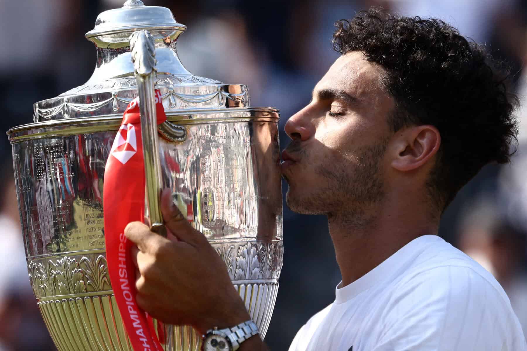 Argentina's Francisco Cerundolo holds trophy with win at Queens Club