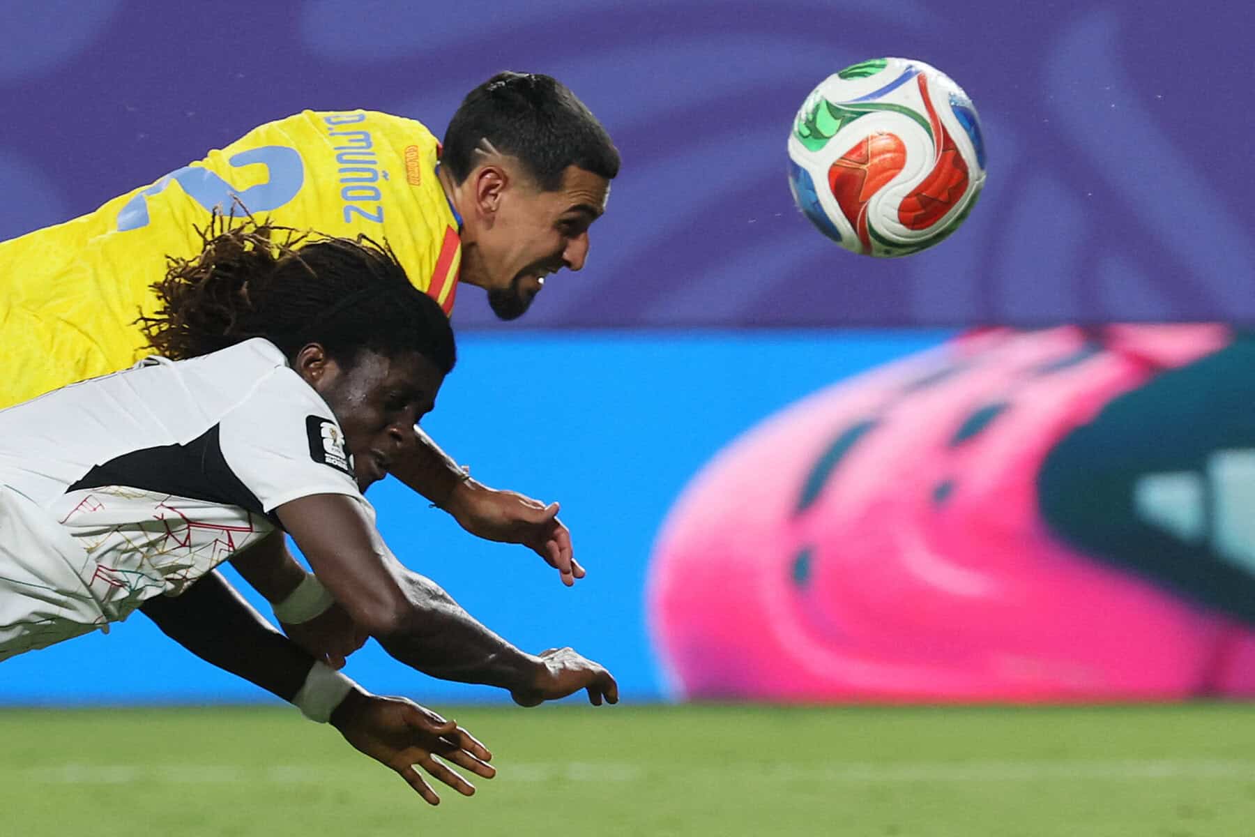 Ghana's midfielder #03 Caleb Yirenkyi and Colombia's defender #02 Daniel Munoz fight for the ball during the 2026 World Cup