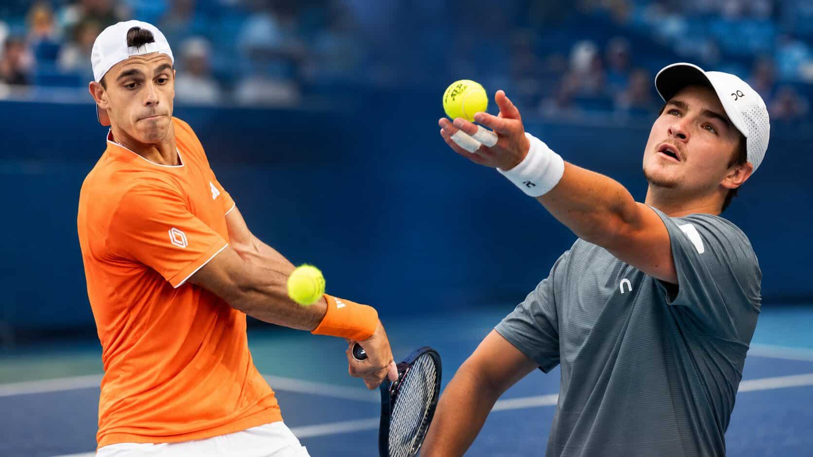 Two Latin American tennis players cerundolo and fonseca in action on a blue hard court, one hitting a backhand in orange and the other preparing to serve in gray.
