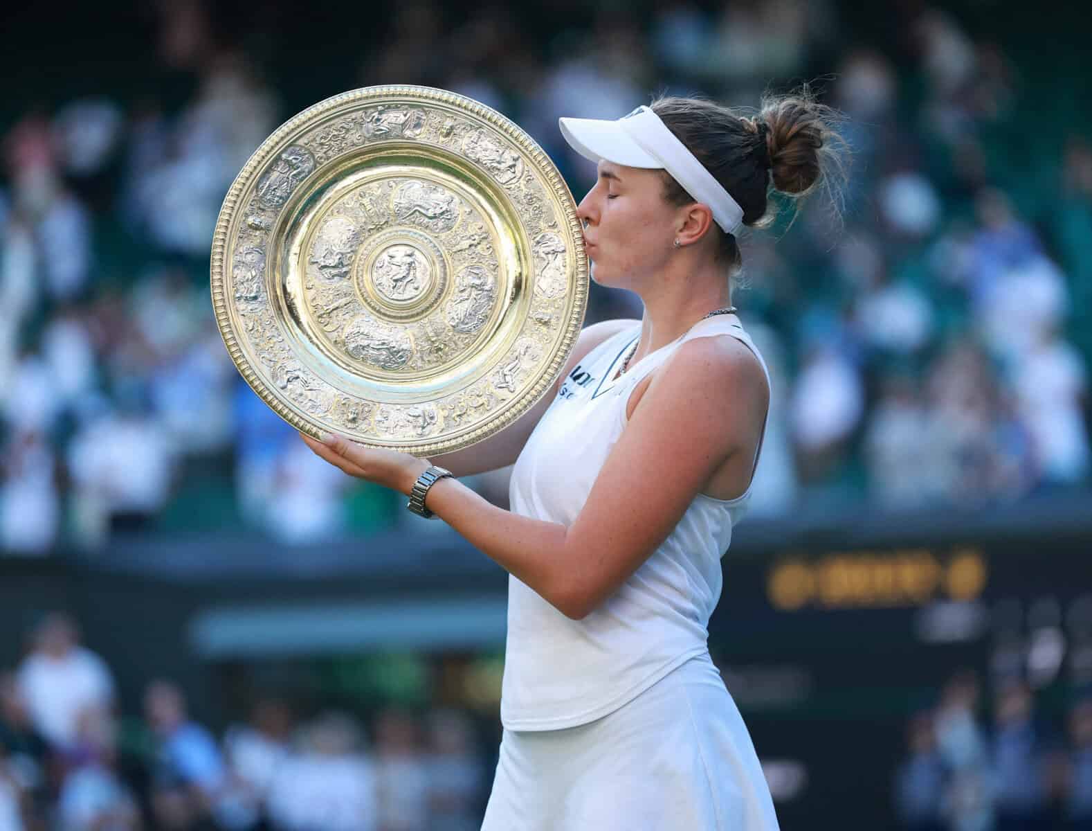 Linda Nosková of Czech Republic holds the 2026 Wimbledon Wome's Trophy after winning