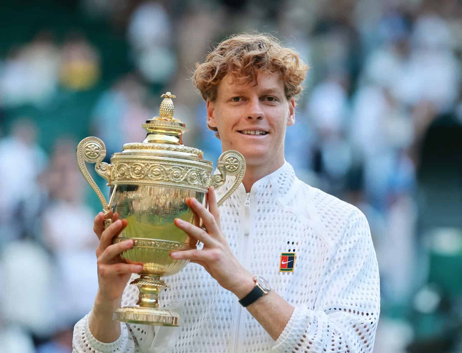 Jannik Sinner holds the Wimbledon men’s singles trophy after defeating Alexander Zverev in the 2026 final.