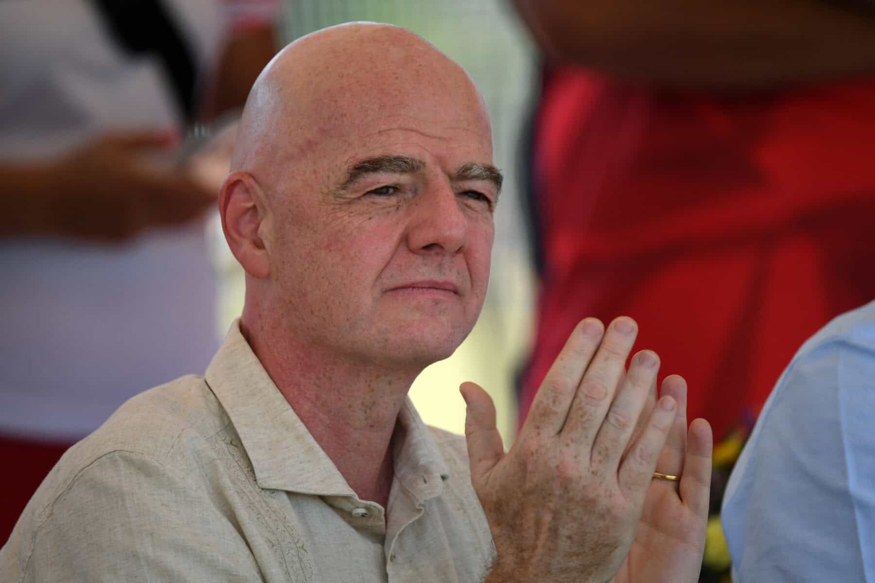 FIFA's president Gianni Infantino applauds during a visit to a sports complex