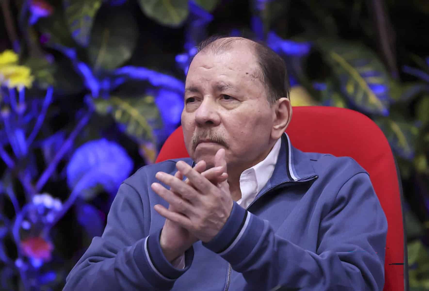 Nicaragua President Daniel Ortega sitting during a procession
