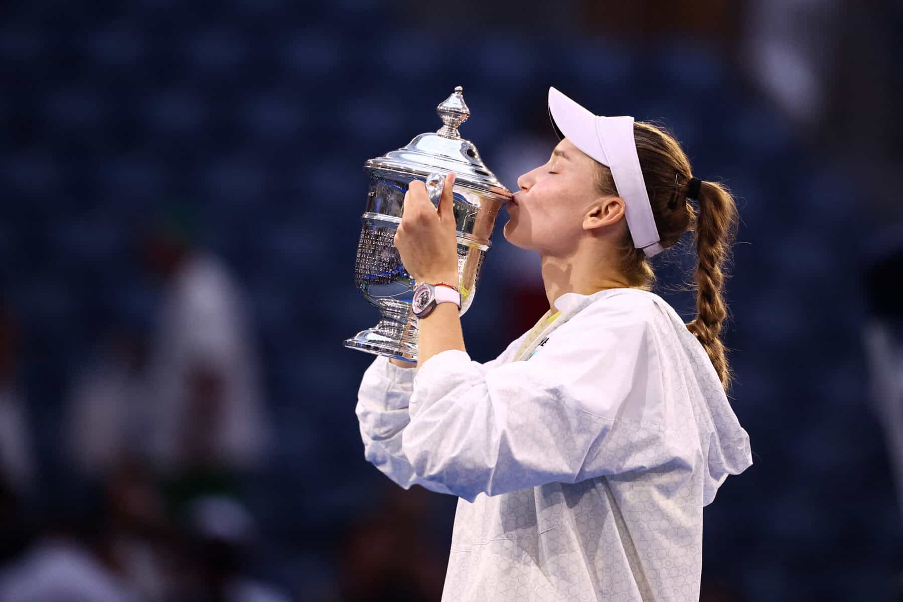 Elena Rybakina kisses the winner's trophy at the 2026 US Open